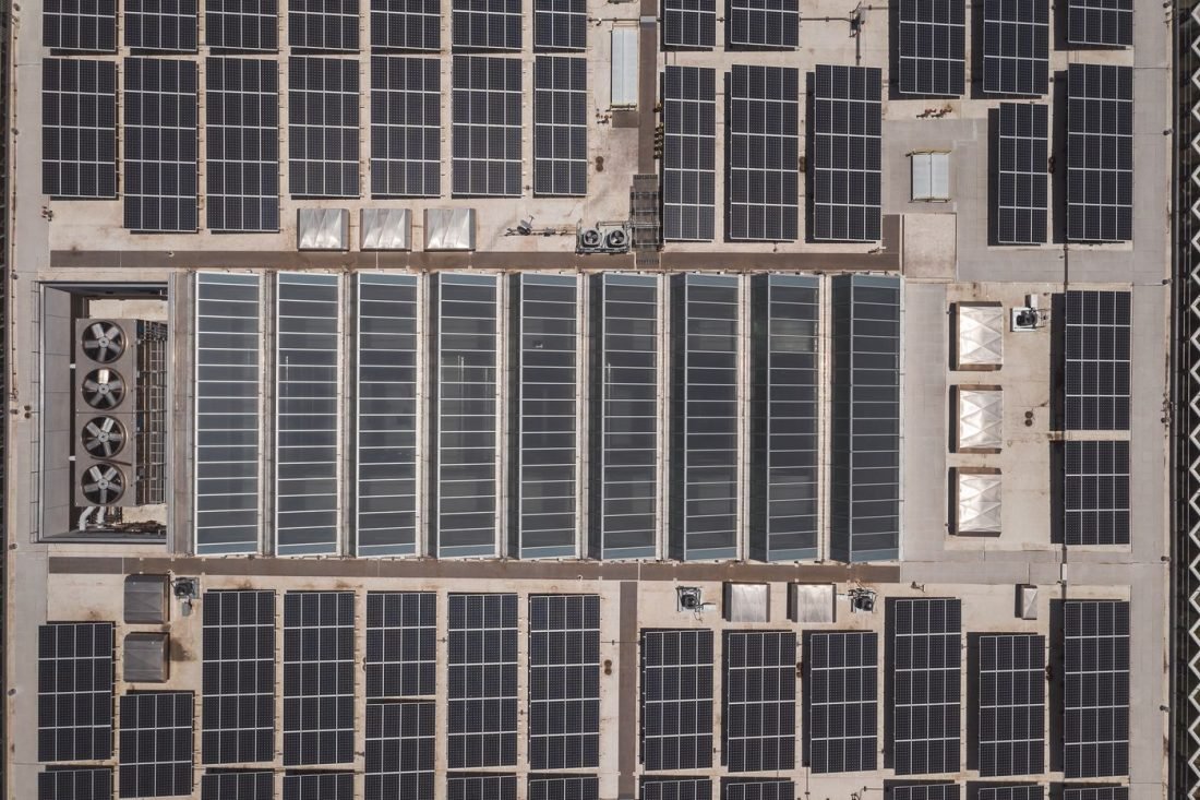 Aerial view of a large rooftop solar installation