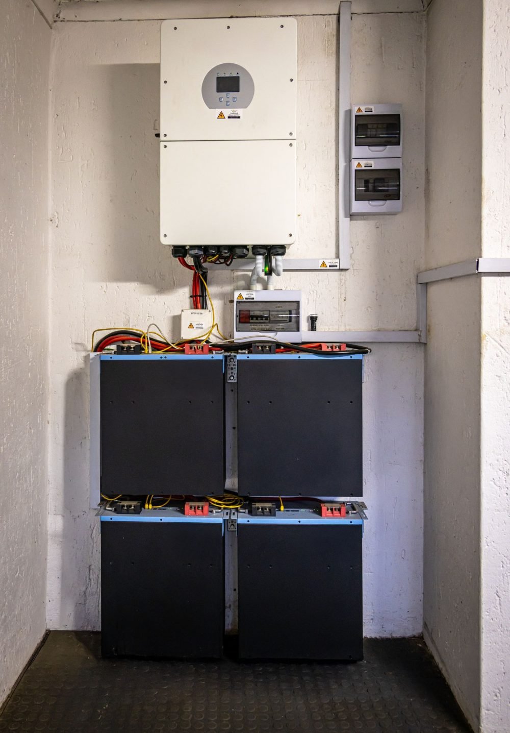 Battery energy storage bank wired to a solar inverter