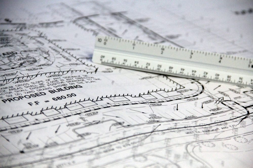 Electrical design drawings and scale ruler for a solar layout